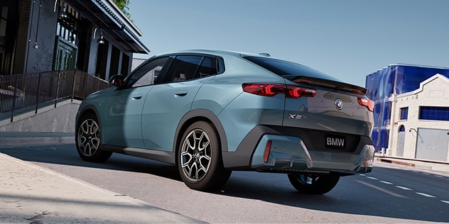 BMW parked in an outdoor setting with a dramatic shadow