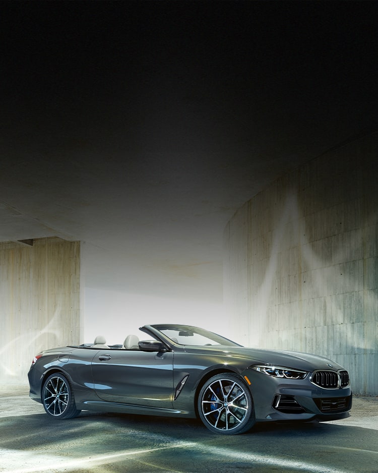 The 2026 BMW 840i Convertible parked with top down