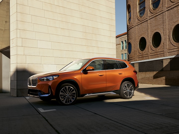 Side view of the BMW X1 parked in an urban setting