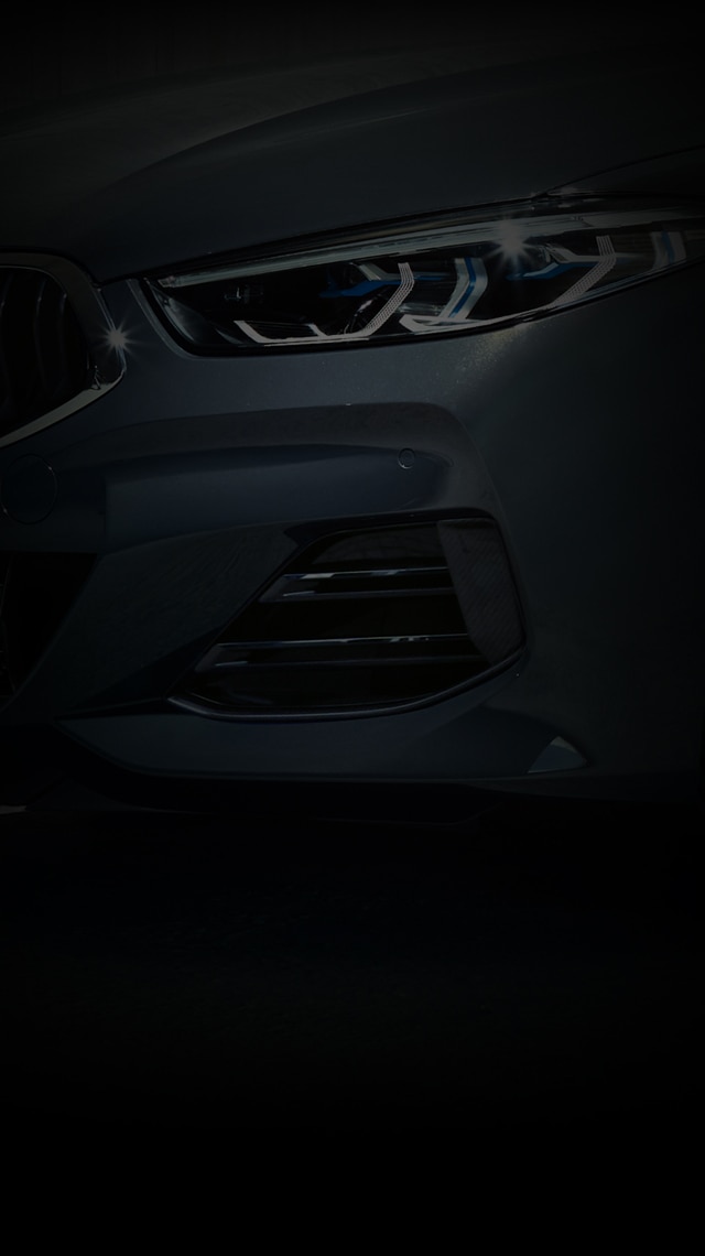 Detail shot of the bold kidney grille and headlights on the 8 Series Convertible