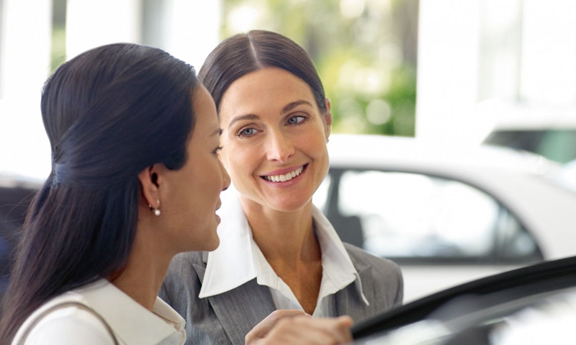 BMW driver receiving assistance at BMW dealer