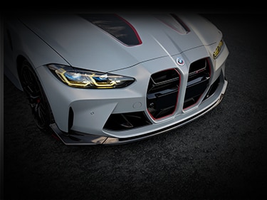 Close-up view of the front quarter of Limited Edition BMW M4 CSL, showcasing low suspension and motorsport inspired design elements