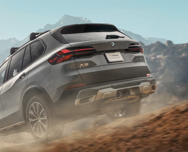 The Silver Anniversary Edition X5 SUV equipped with factory installed roof crossbars and hitch