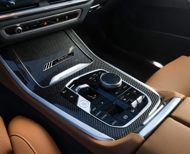 Detail of the center console featuring Carbon Fiber trim and Anniversary Edition badging