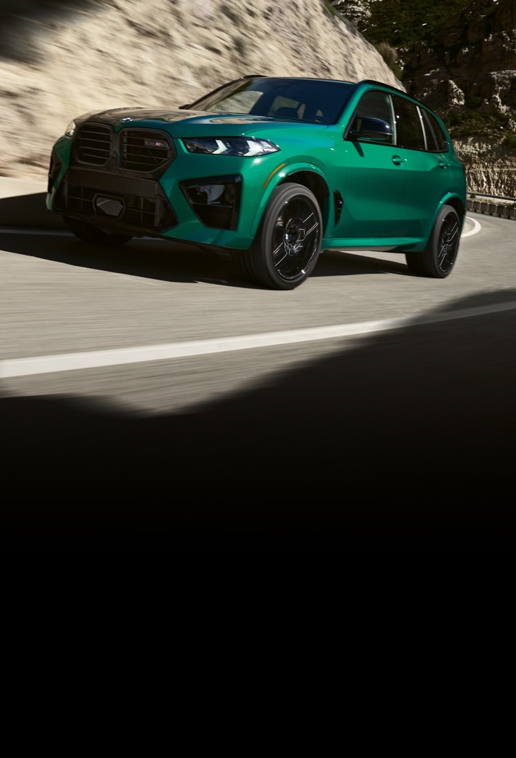 The BMW X5 M Competition ascends up a mountain road