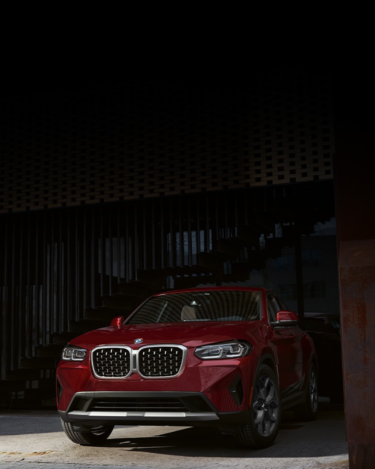 Front shot of X4 xDrive30i in Piemont Red Metallic